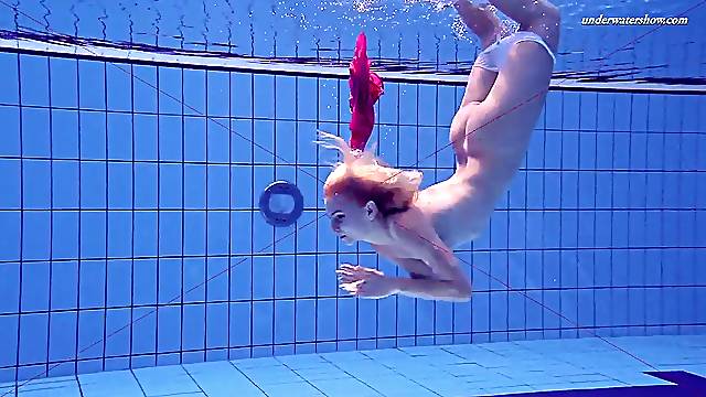 Russian babe Elena Proklova with small tits swimming naked