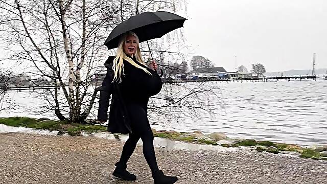 Blonde is flashing her big boobs in the outdoors