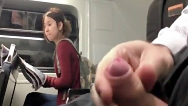 Chinese girl looking at my cock at the bus