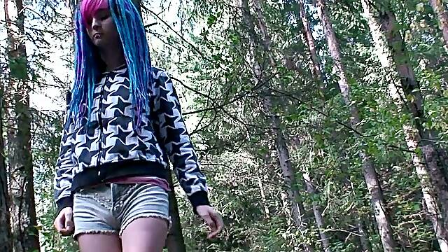 Blue haired alternative chick is ready to piss outdoors in the woods