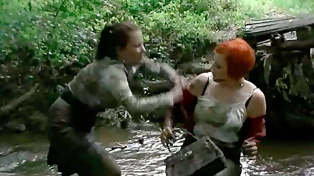 Two hot redhead and brunette bitches have a catfight in mud
