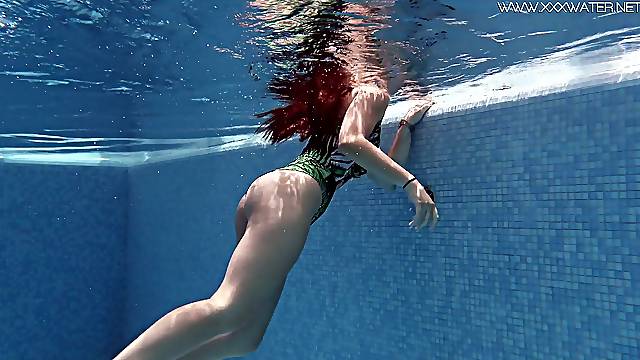 Gorgeous red haired mermaid Diana Rius shows underwater striptease