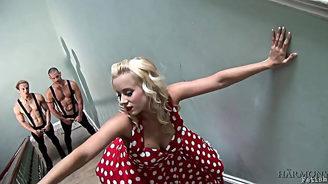 Bitch in polka dot dress Cindy Dollar seduces two muscular dudes on the stairs