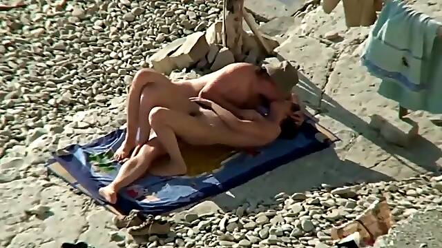Couple share hot moments on the nudist beach