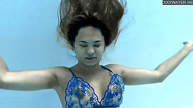 Half Russian and Spanish girl Irina Cage swimming naked.