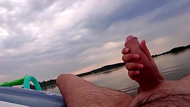 My wife jerks off my dick with a happy ending in the inflatable boat on the lake
