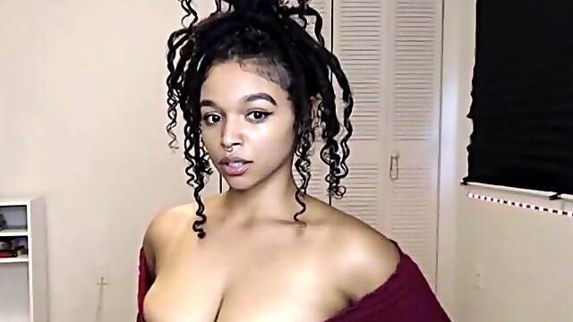 Busty Ebony masturbating with her Lush