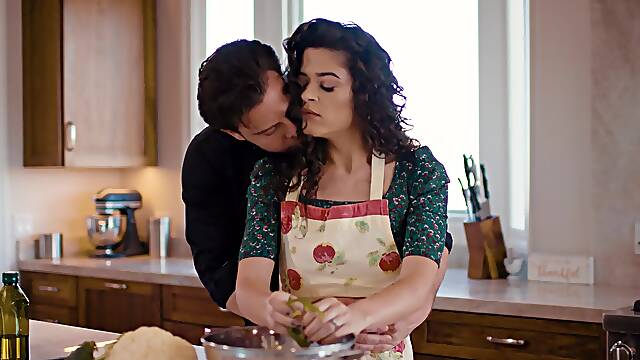 Curly brunette stops cooking to take her dose of tasty dick