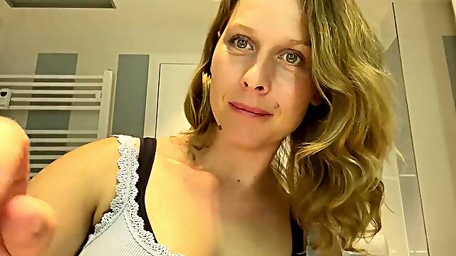 Ugly mom fondles her boobs while putting her make up on