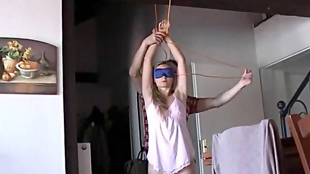 Hanka is hanged spanked and teased, Sexy blonde MILF Hanka dressed only in shirt is hanged. So...