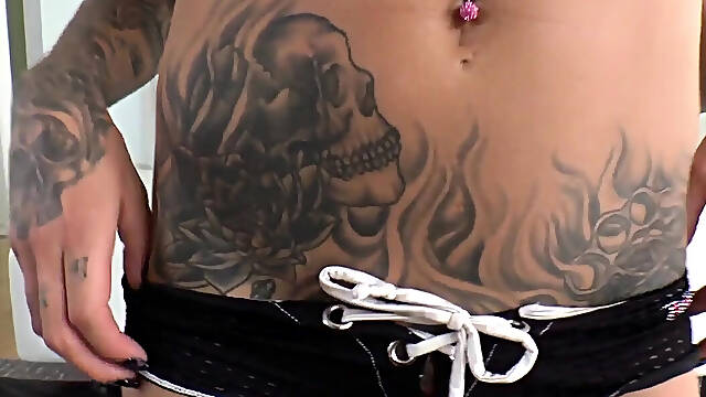 Busty babe with ink and piercings gets cumshot