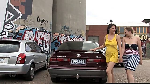 Girls Out West - Busty lesbians at the car park