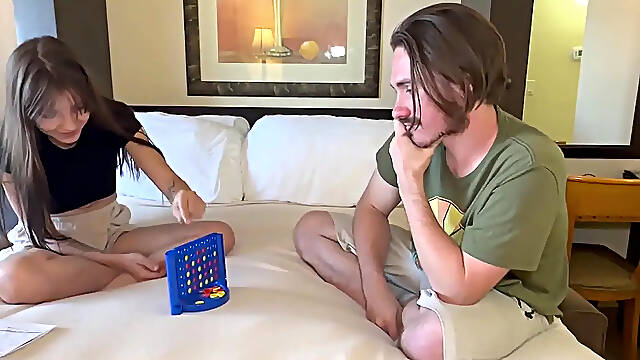 Couple loses clothes playing strip Connect 4 in bed
