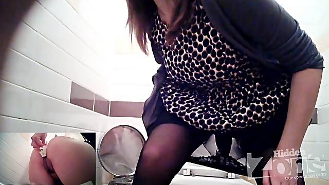 Fantastic slut in black stockings pissing on public toilet