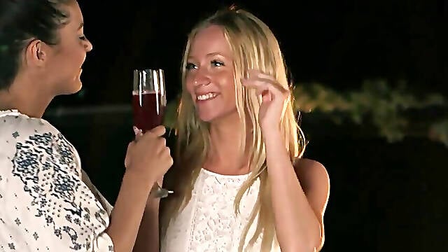 Blonde and brunette double team a large penis while outside