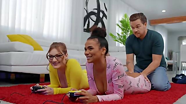 Interracial threesome makes the girls forget about video game