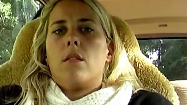 Blonde masturbating in the car in the parking lot