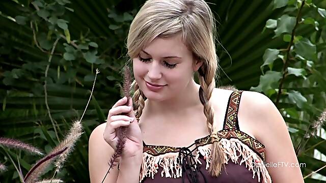 Pigtailed beauty toys her hot pussy at a picnic