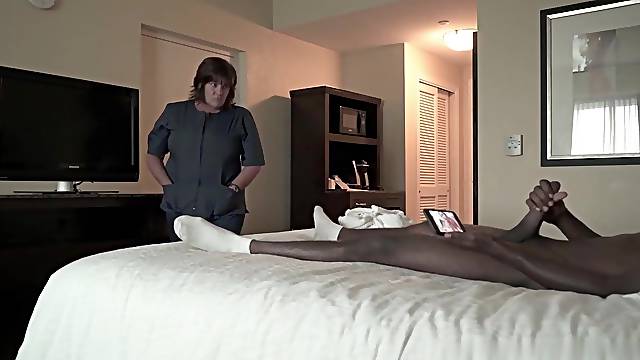 Corpulent maid is fascinating a ebony chap in a hotel room and listening to his groans