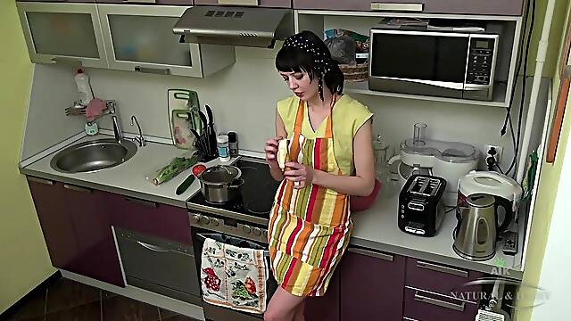 Small short-haired housewife in high heels rubs her shaggy pussy on the kitchen counter