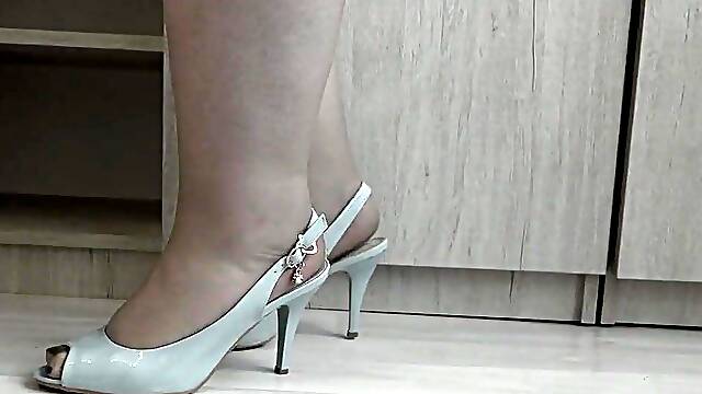I put on nylon tights and try on high-heeled shoes.