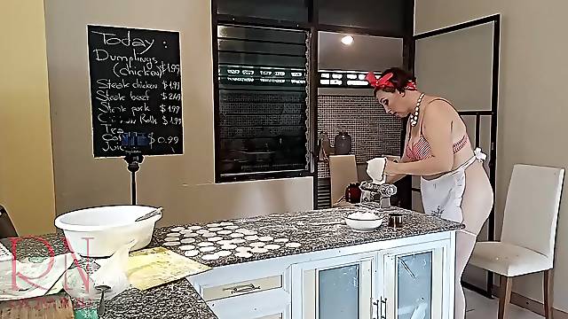 Nudist housekeeper Regina Noir cooking at the kitchen. Bare maid makes dumplings. Bare cooks Brassiere