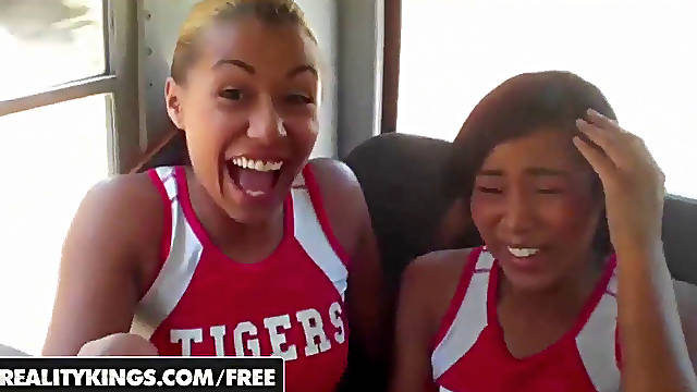 Ebony Cheerleaders  in uniform gargle and lick on the bus - REALITYKINGS