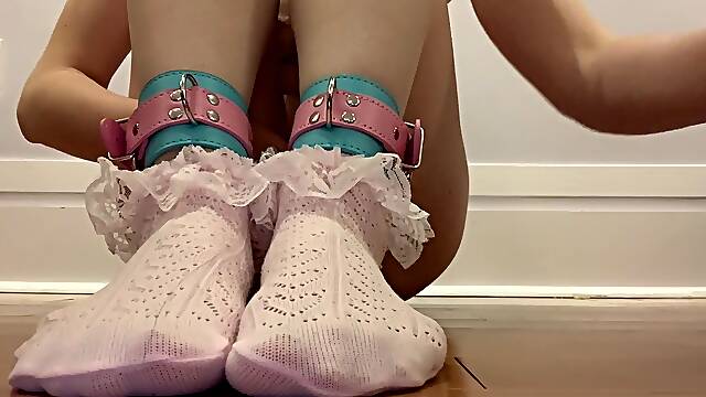 I put on ankle cuffs while wearing uber-cute frilly socks, then I finger myself until I burst