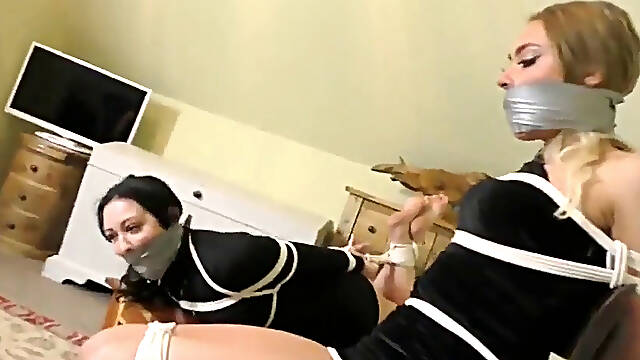 2 girls roped up and heavily gagged