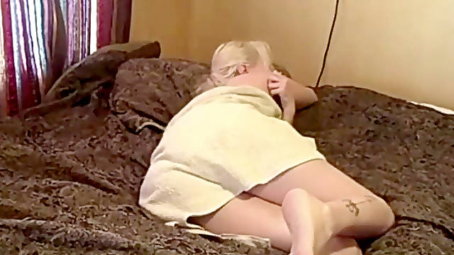 Blonde damsel farting wearing a towel