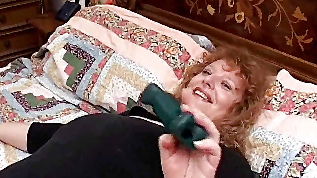 Talking on the phone, the italian milf masturbates by inserting double and long sex toys in her horny and eager holes
