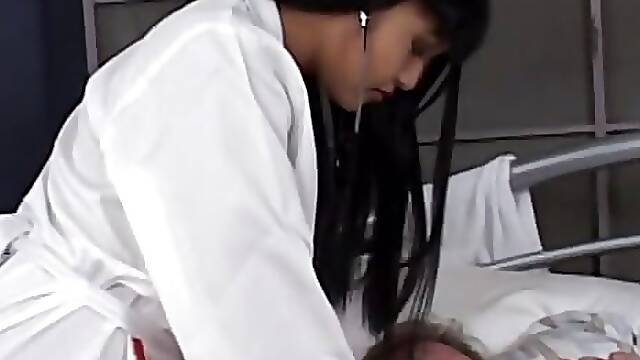 Horny Asian nurse babe with nice tits sucks and fucks a juicy dick in bed