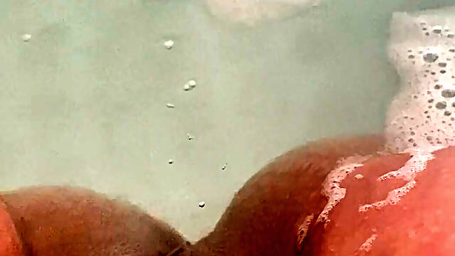 Massaging my pussy in the bath