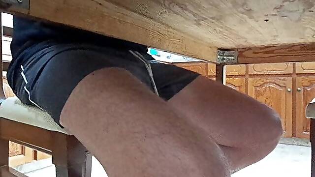 Footjob under dinner table