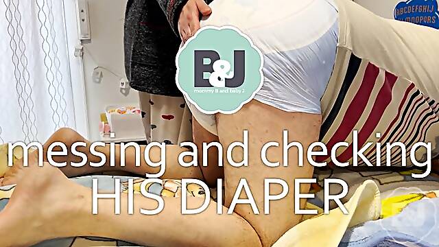 Messing and checking his diaper