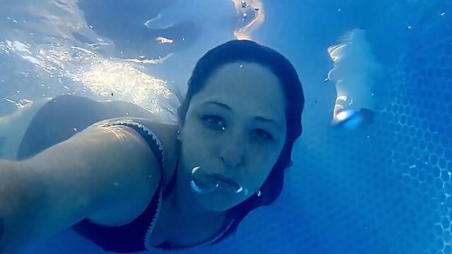 Underwater play, bubbles, rings, talking, swimming