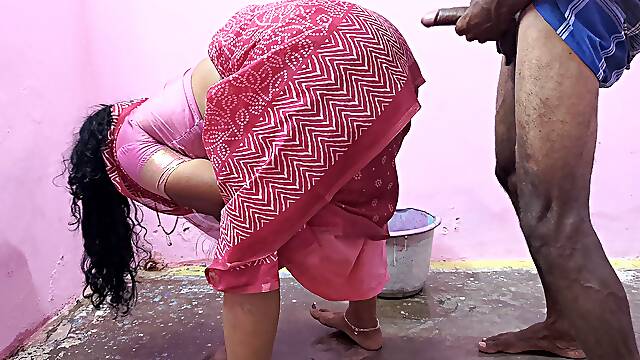 Aunty is cleaning the floor when a young boy has sex with her