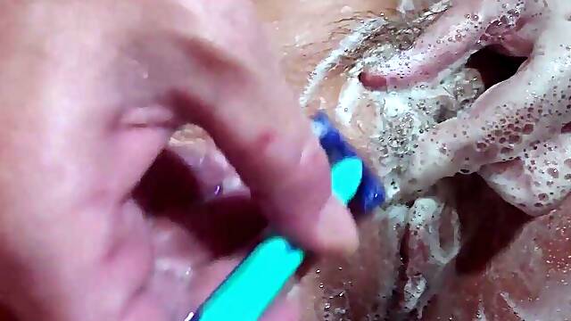 Shaving, washing in bubbles and finger fucking naked in the bath tub