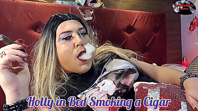 Holly in Bed Smoking a Cigar
