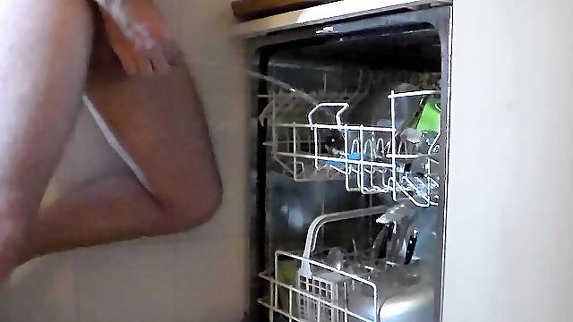 John is peeing into the dishwasher when it is full