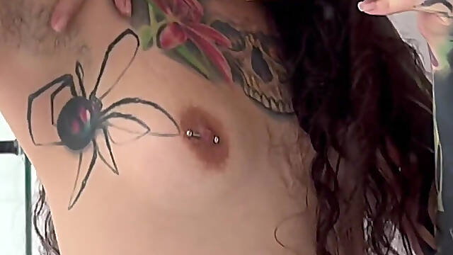 Tattooed Girl with a Split Tongue Smells Her Hairy Armpits After Working Out