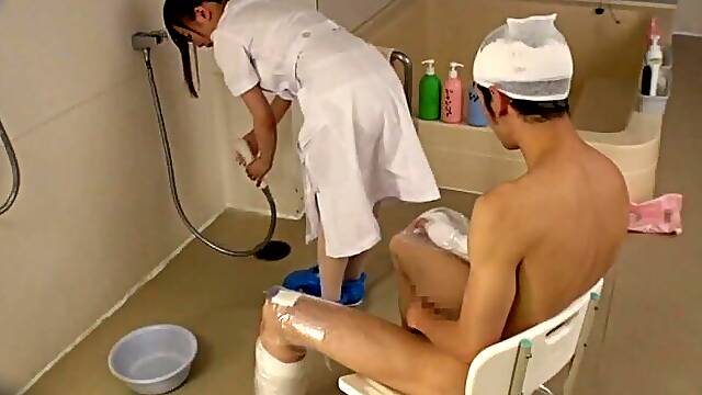 Asian nurse pleases a patient while cleaning him up in the bathroom