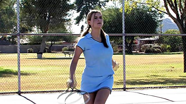 Amateur girl Danielle takes off her top while playing tennis